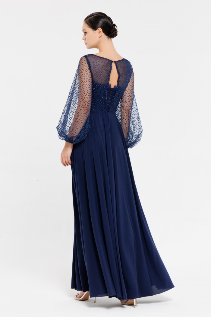 ЗЕНДАЯ - Длинное синее платье с блеском на лифе с длинным рукавом и высоким разрезом по ноге  | Paulain