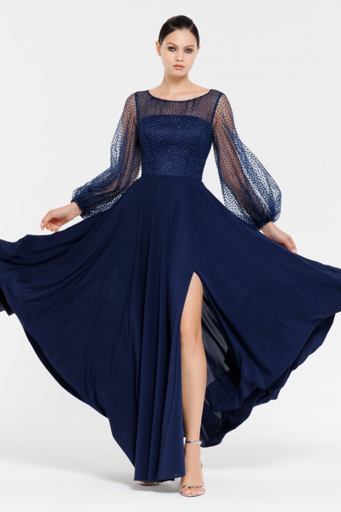 ЗЕНДАЯ - Длинное синее платье с блеском на лифе с длинным рукавом и высоким разрезом по ноге  | Paulain